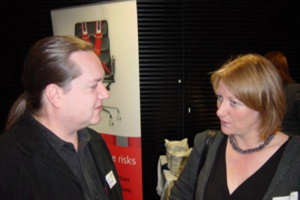 Kate Gilmore of Invest NI Trade Division receives an update from Mark Gowdy on Aetopia's recent success in the Netherlands