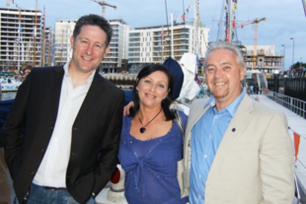 Brian Sofley, Sales Director of Powershield enjoys exchanging Middle East trading anecdotes with Mr. and Mrs Cregan Boyd of Trackcare International. 